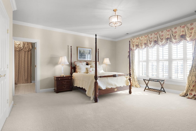 carpeted bedroom with crown molding and baseboards