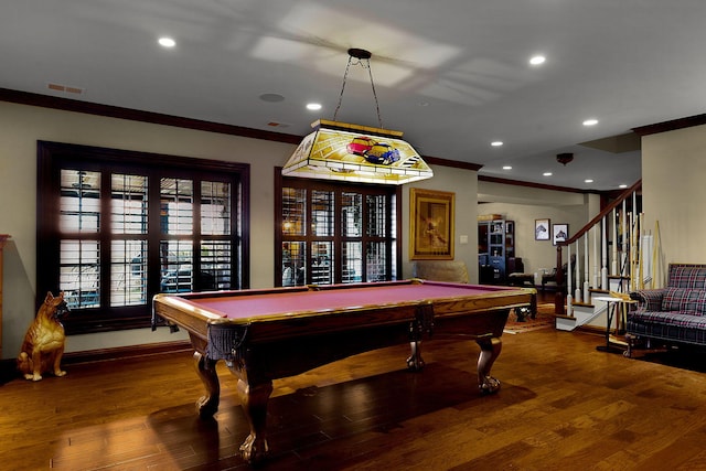 game room with ornamental molding, baseboards, and wood finished floors