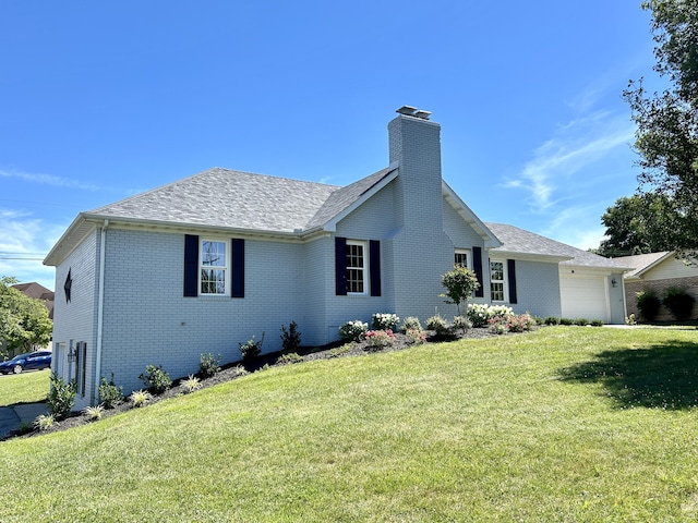 ranch-style home featuring a garage and a front yard