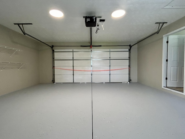 garage featuring a garage door opener