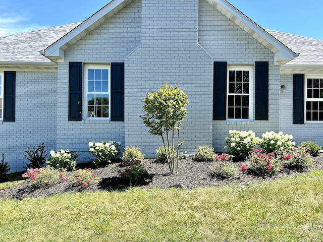 view of property exterior featuring a yard