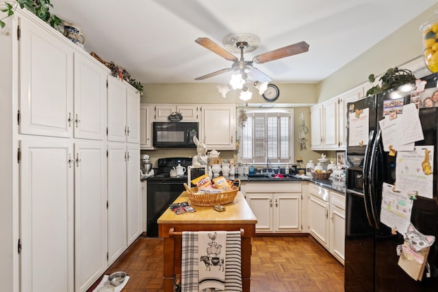 kitchen with black appliances, dark parquet floors, white cabinets, and sink