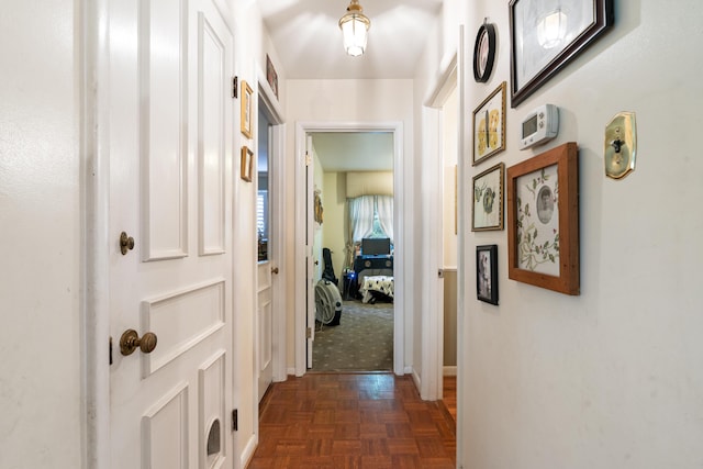 corridor featuring dark parquet floors