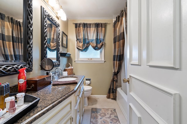 full bathroom featuring vanity, toilet, and shower / bath combo with shower curtain