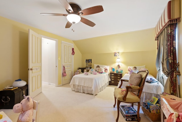 carpeted bedroom featuring ceiling fan and vaulted ceiling