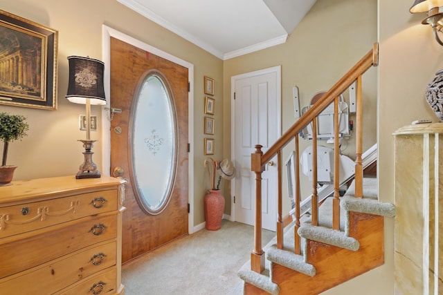 foyer with light carpet and ornamental molding