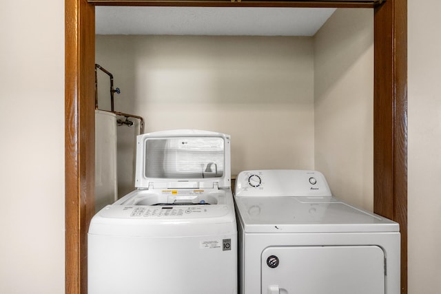 washroom featuring washer and clothes dryer