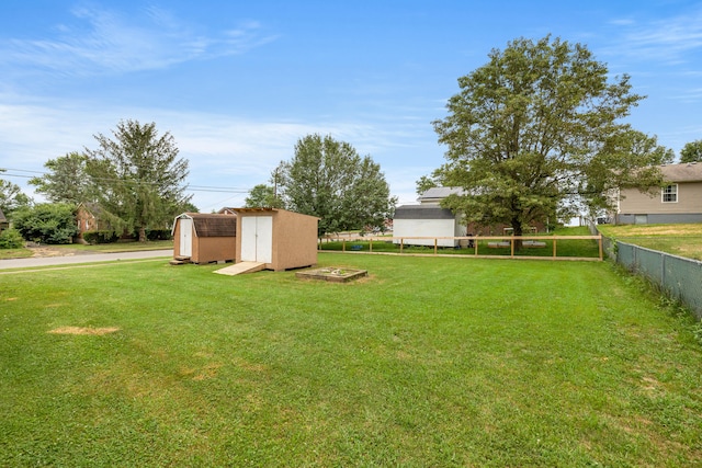 view of yard with a storage unit