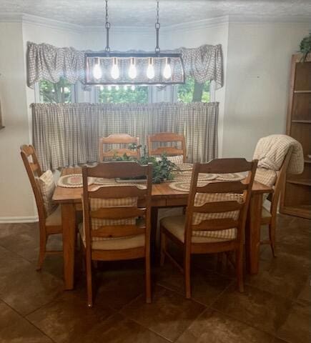 dining area with crown molding