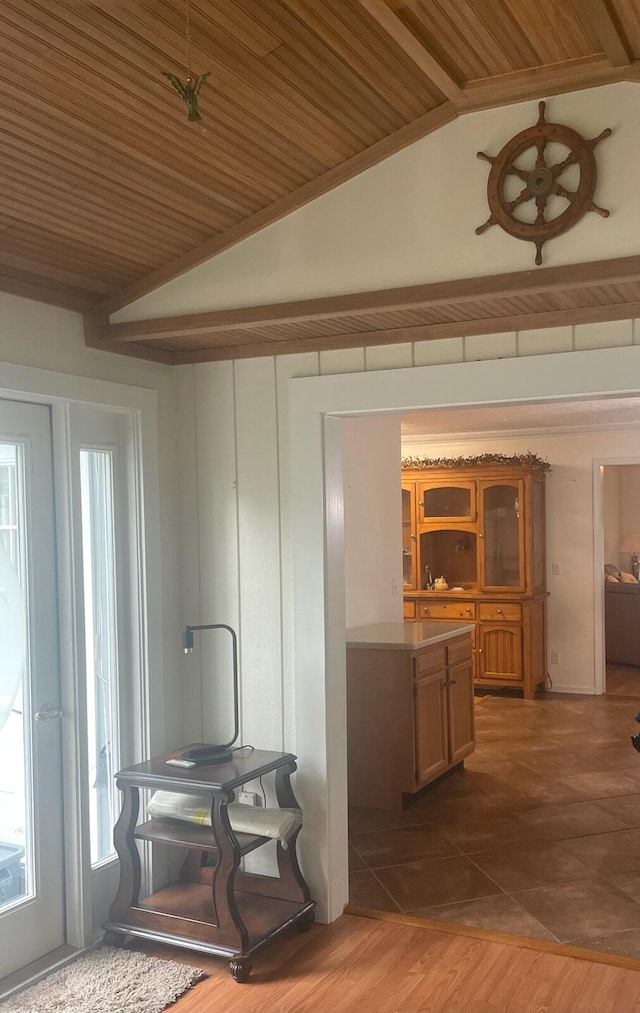 hallway with vaulted ceiling, dark wood-type flooring, and wood ceiling