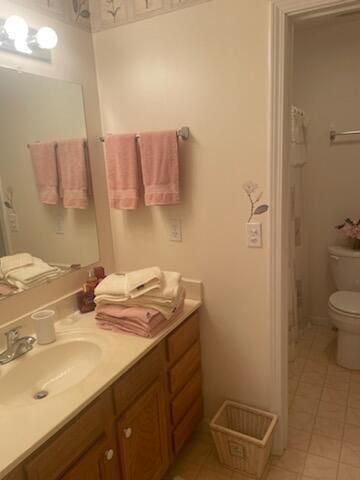 bathroom featuring vanity and toilet