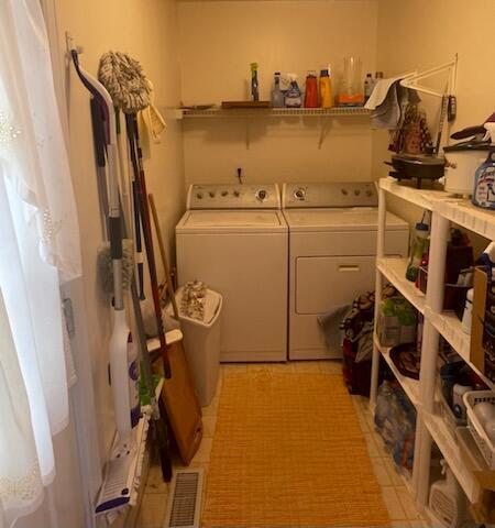 clothes washing area featuring washing machine and clothes dryer