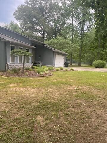 view of yard featuring a garage