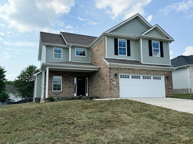 craftsman house with a front lawn and a garage