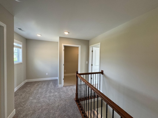 hall with carpet floors