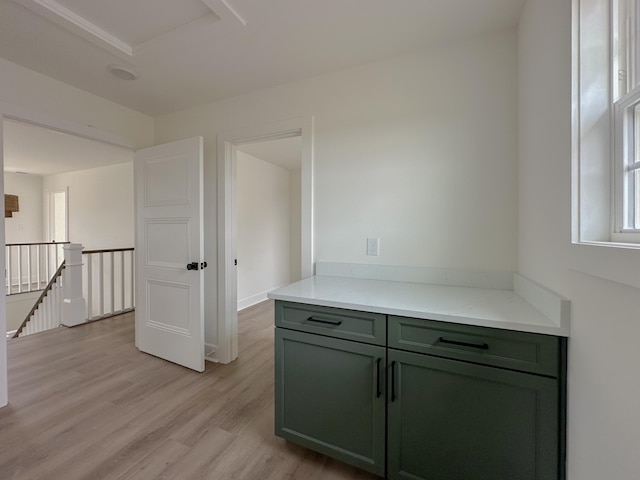 corridor with light hardwood / wood-style floors