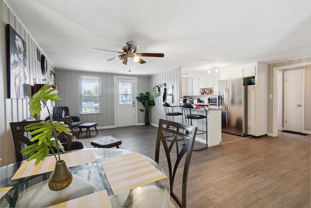 living room with hardwood / wood-style floors and ceiling fan