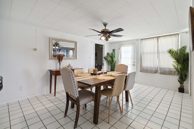 dining area with ceiling fan and light tile patterned floors