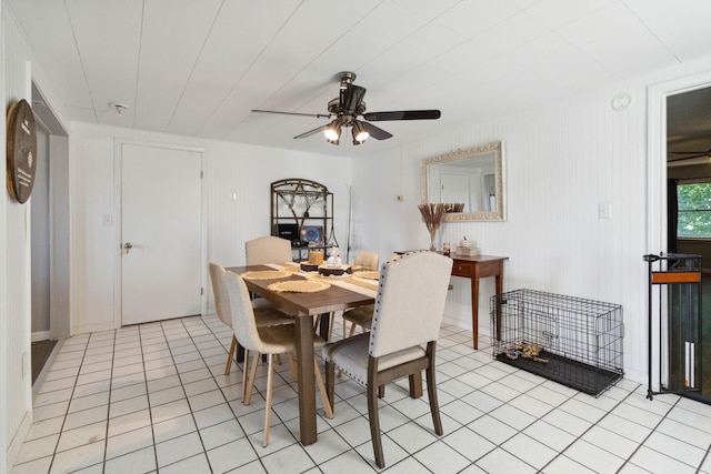 tiled dining space featuring ceiling fan