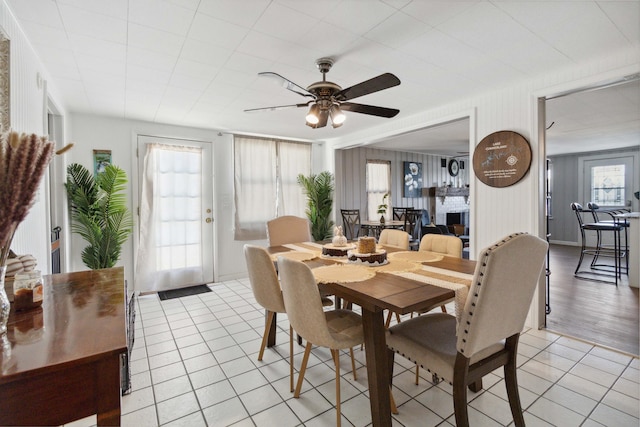 living room featuring ceiling fan and dark wood-type flooring