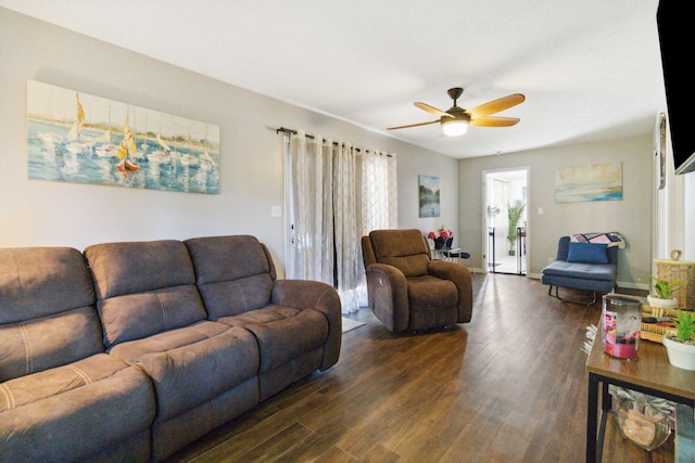 living room featuring dark hardwood / wood-style floors and ceiling fan