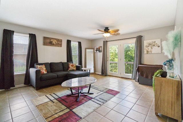 tiled living room with ceiling fan