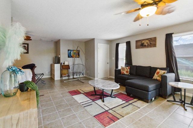 tiled living room with ceiling fan