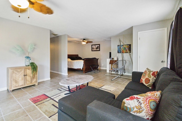 living room featuring ceiling fan and light tile patterned floors