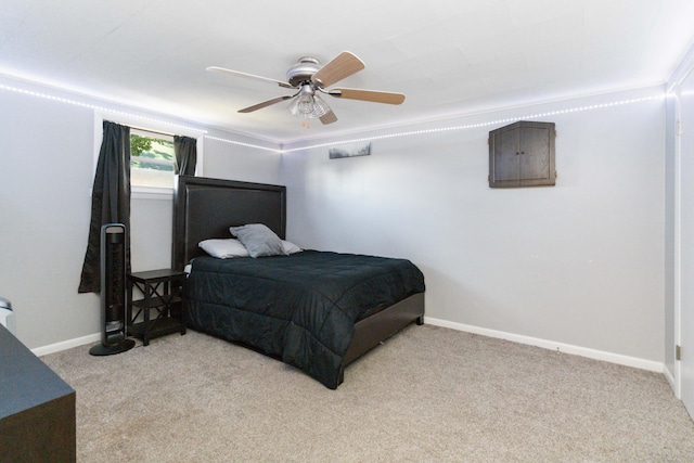 bedroom featuring ceiling fan and light carpet