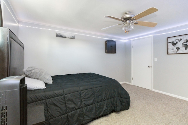 bedroom featuring carpet floors, a closet, ceiling fan, and crown molding