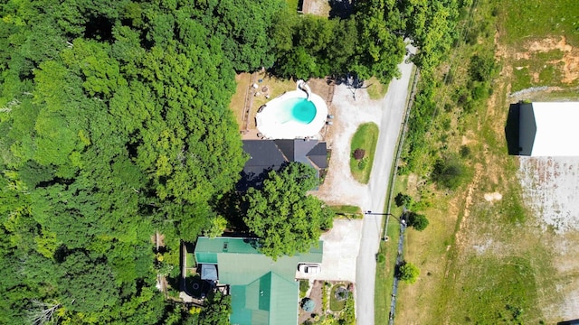 view of swimming pool featuring a wooden deck and a water slide