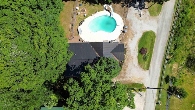 bungalow with a fenced in pool and covered porch