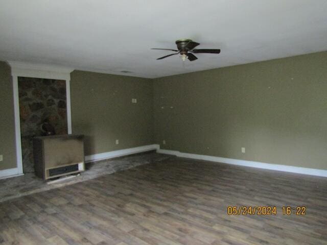 unfurnished living room featuring hardwood / wood-style flooring and ceiling fan