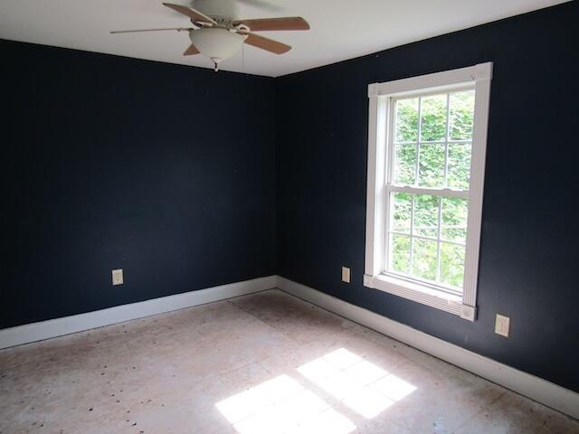 spare room featuring ceiling fan