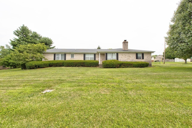 ranch-style home with a front lawn