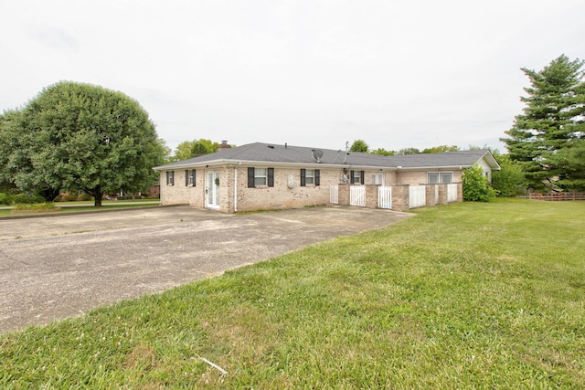 single story home featuring a patio and a front yard