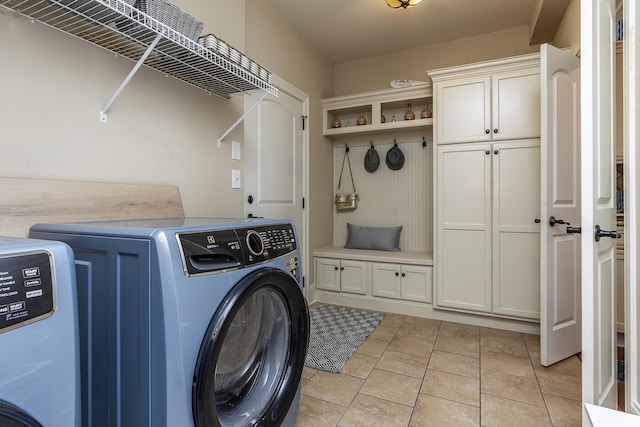 laundry area with cabinets and washing machine and dryer