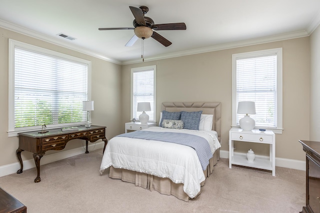 carpeted bedroom featuring ceiling fan and ornamental molding