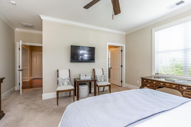 carpeted bedroom with ceiling fan, crown molding, and multiple windows