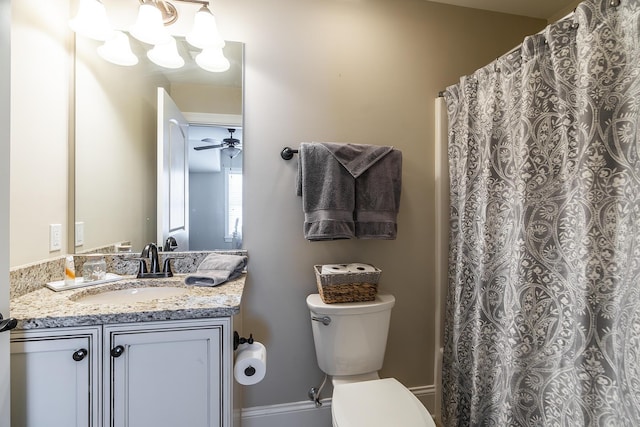 bathroom with vanity, ceiling fan, and toilet