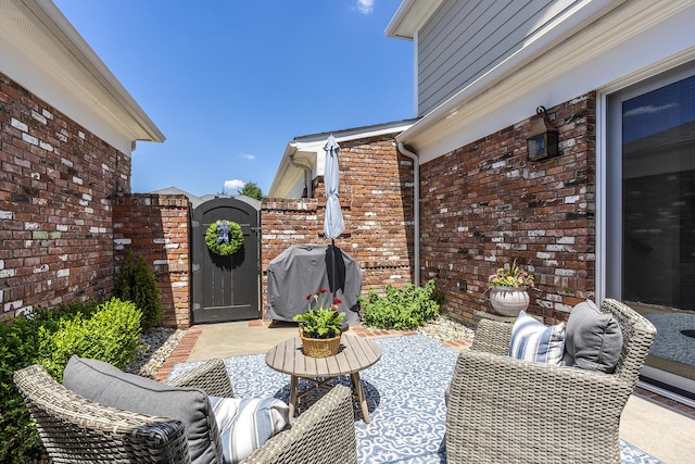 view of patio with a grill