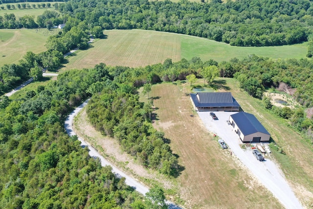 birds eye view of property with a rural view