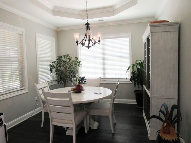 dining room featuring a wealth of natural light, dark wood-type flooring, and baseboards