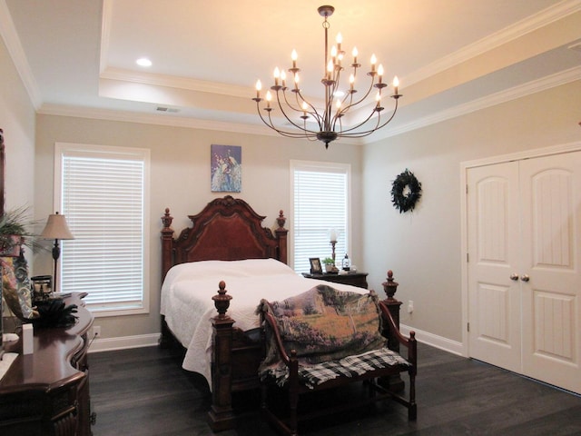 bedroom featuring an inviting chandelier, baseboards, a raised ceiling, and dark wood-style floors