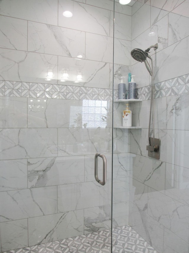 full bath with a shower stall