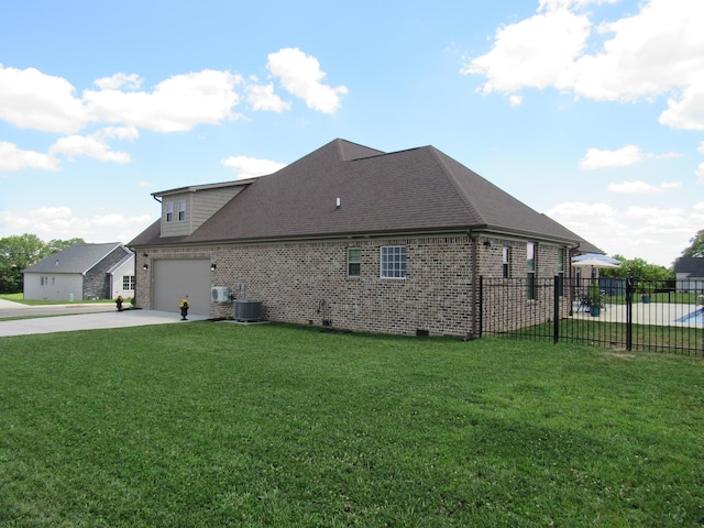 view of side of property featuring concrete driveway, a yard, fence, and cooling unit