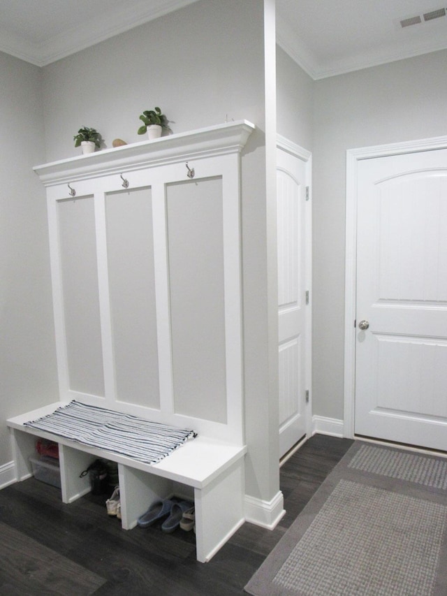 mudroom with baseboards, ornamental molding, visible vents, and dark wood-style floors