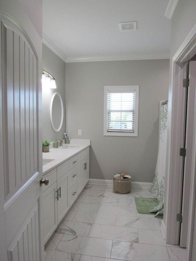 full bath featuring double vanity, a sink, visible vents, baseboards, and marble finish floor
