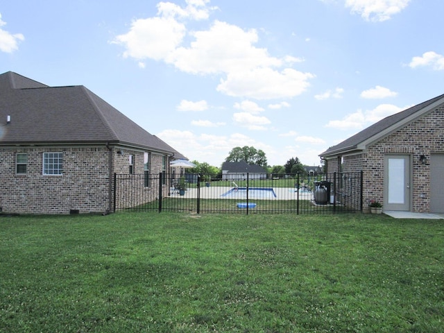 view of yard with a fenced in pool and a fenced backyard