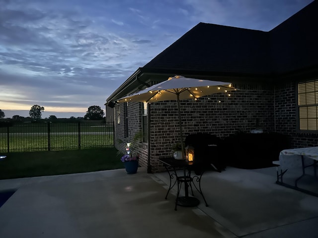 patio terrace at dusk with fence